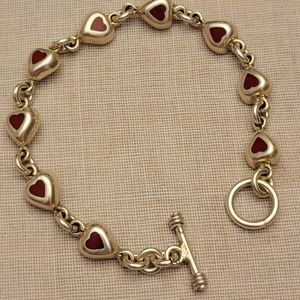 Adorable Sterling heart bracelet inlaid with nine red hearts ❤️